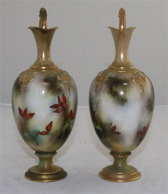 A pair of Royal Worcester peacock painted ewers, c.1905, 20.3cm (8in.), one restored